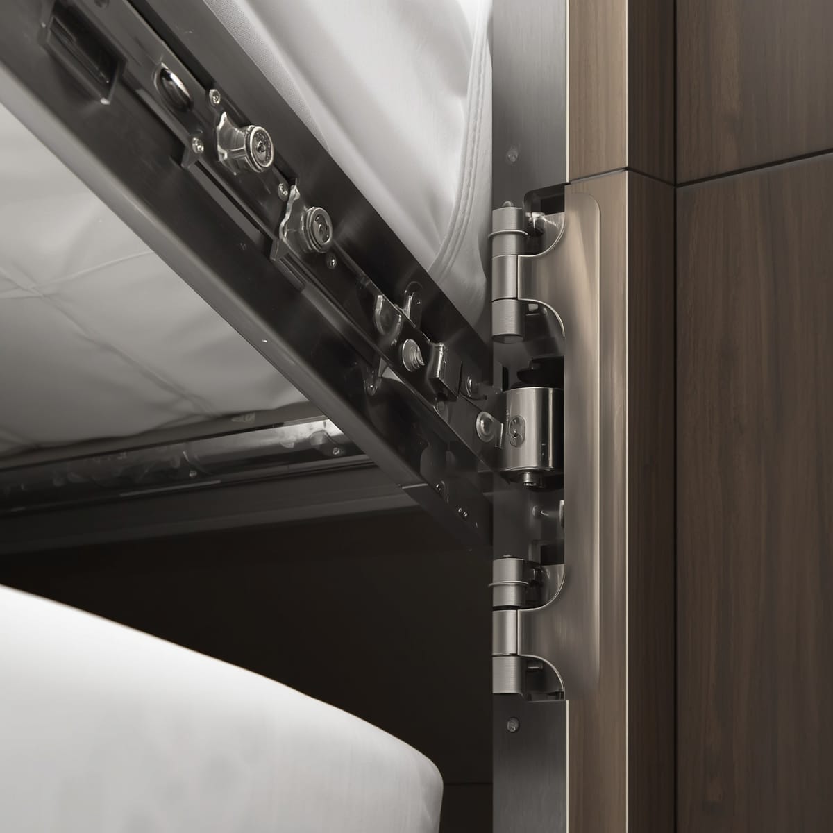 Close-up of a sturdy gas-piston wall-bed mechanism and hinges